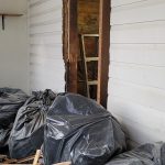 old south window hole being reframed, exterior